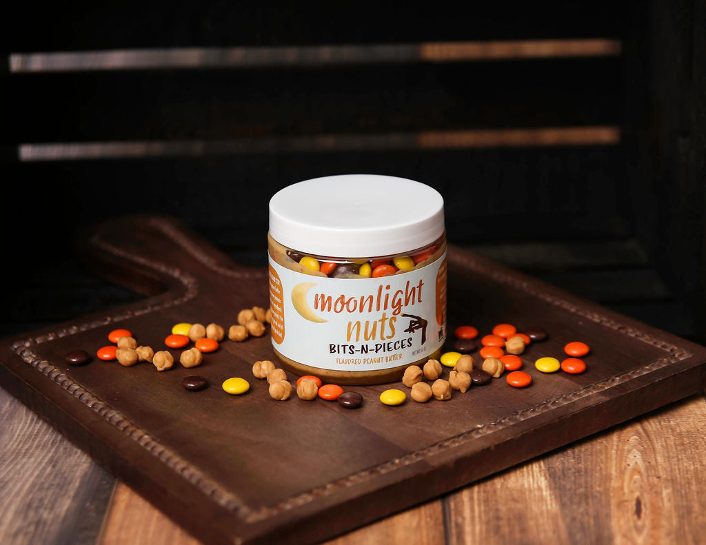Caramel bits, caramel sauce, and Reese’s pieces in a white chocolate peanut butter