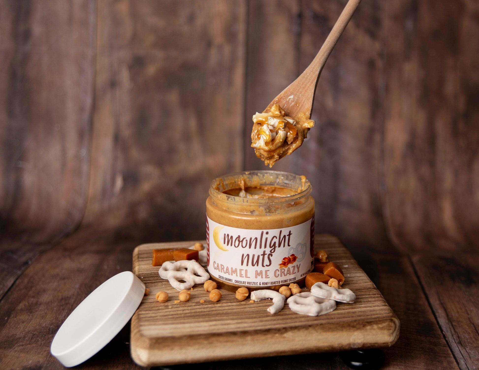 Spoonful of moonlight nuts caramel me crazy honey roasted peanut butter featuring white chocolate pretzels, caramel bits, and salted caramel sauce