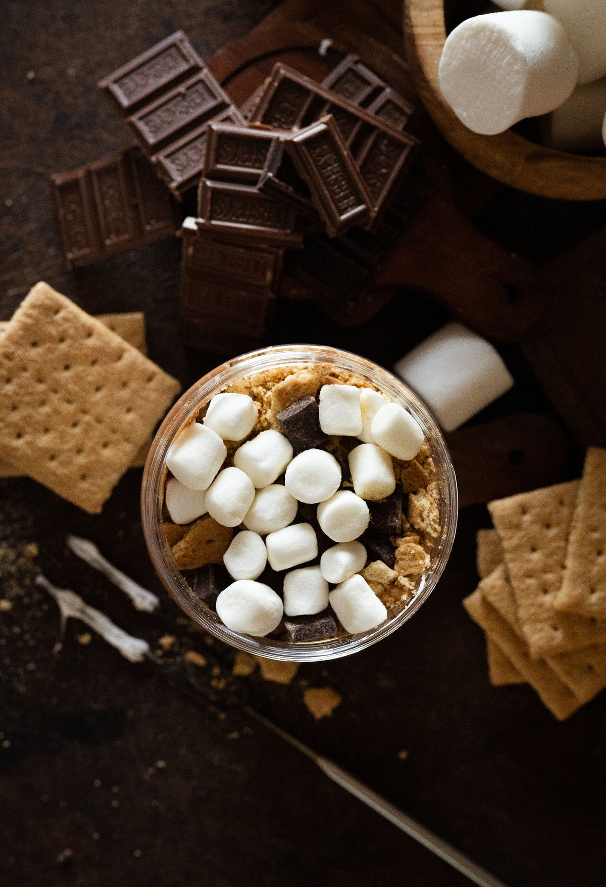 Top view of moonlight nuts gimme s’more peanut butter showing graham crackers, chocolate chunks, marshmallows, and milk chocolate peanut butter