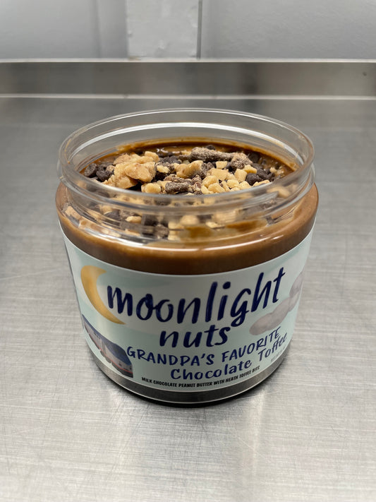 Moonlight Nuts Grandpa’s favorite- Chocolate Toffee with lid open showing the toffee bits and milk chocolate peanut butter