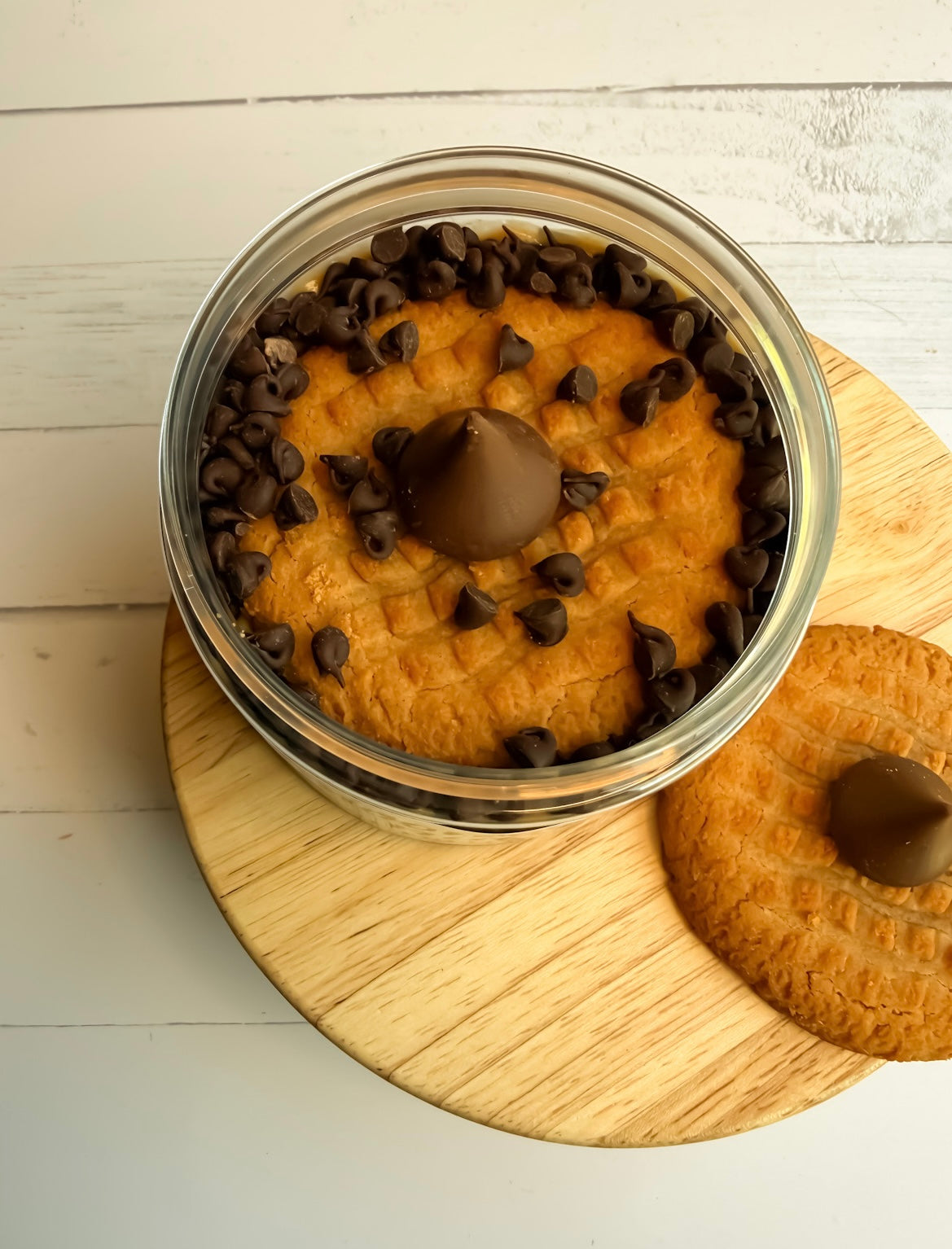 Top view of moonlight nuts peanut butter blossom peanut butter flavor. Showing white chocolate peanut butter, mini chocolate chips, peanut butter cookie, and a Hersheys®️ kiss on top
