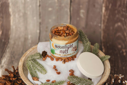 Jar of cinnamon roll moonlight nuts peanut butter and salted caramel sauce