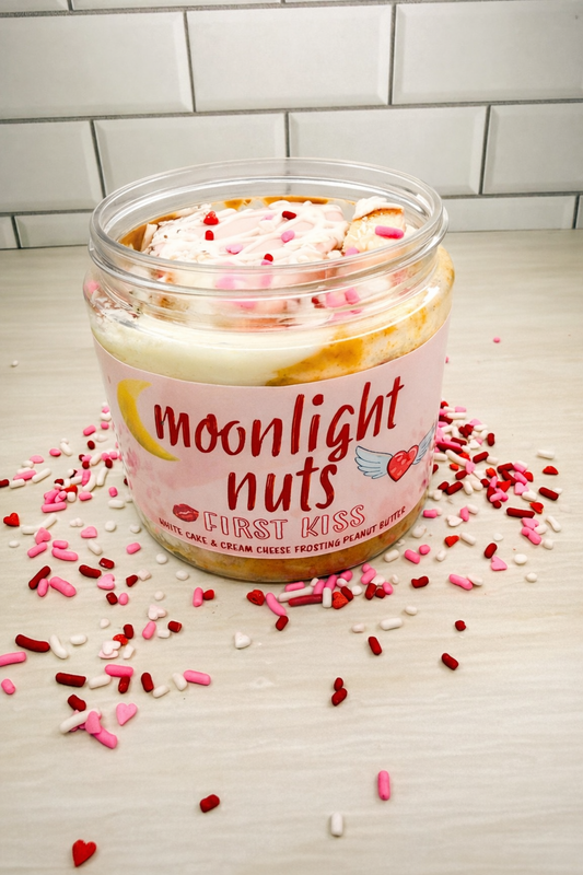 Moonlight nuts valentines flavor white chocolate peanut butter with cream cheese frosting, white cake, chocolate curls, and sprinkles